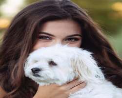 She has a cute dog in her home with whom she loves to play and calls him her everything.